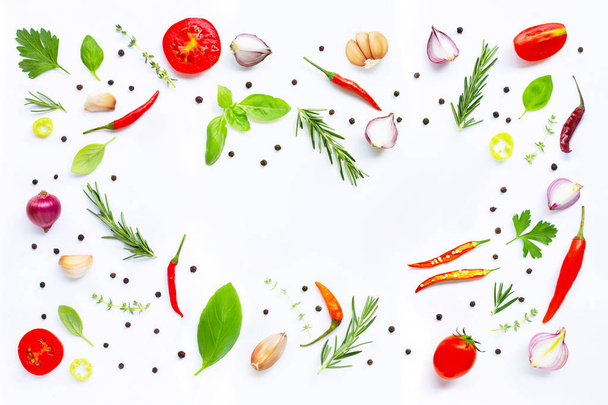 Különböző friss zöldségek és fűszernövények, fehér háttér.  - Fotó, kép