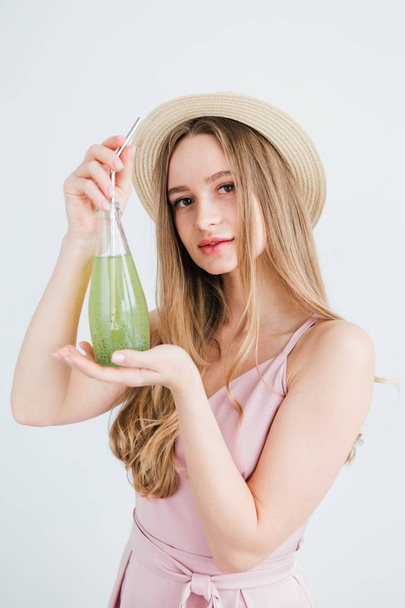 Girl drinks a healthy green drink with Basil seeds  - Fotó, kép