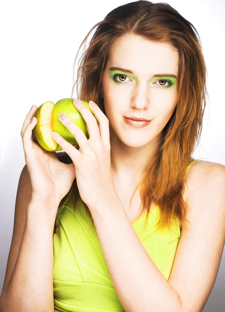 Young woman with green apple - Fotó, kép