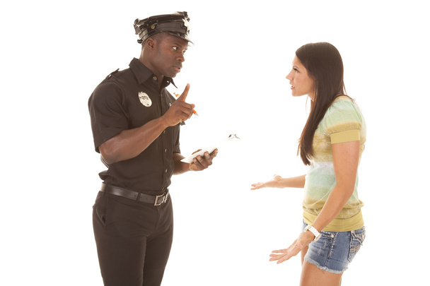 policeman writing ticket to woman - Foto, immagini