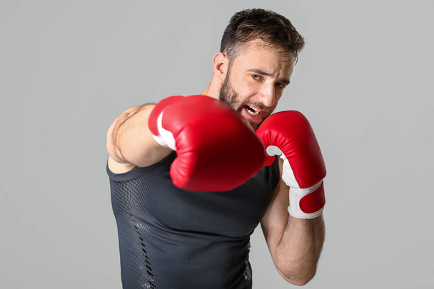Strong male boxer on grey background - Fotoğraf, Görsel