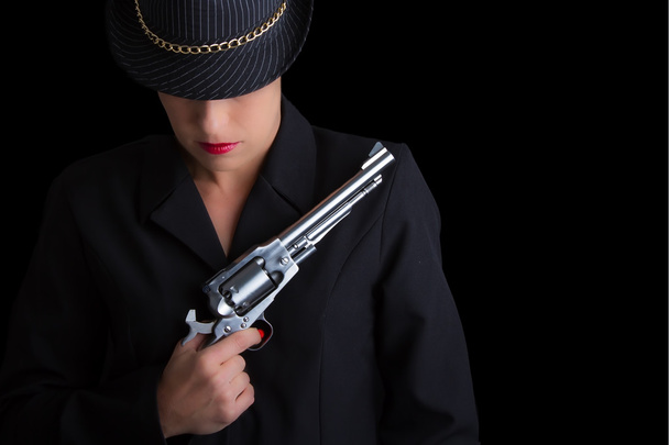 Dangerous woman in black with silver handgun - Foto, Bild
