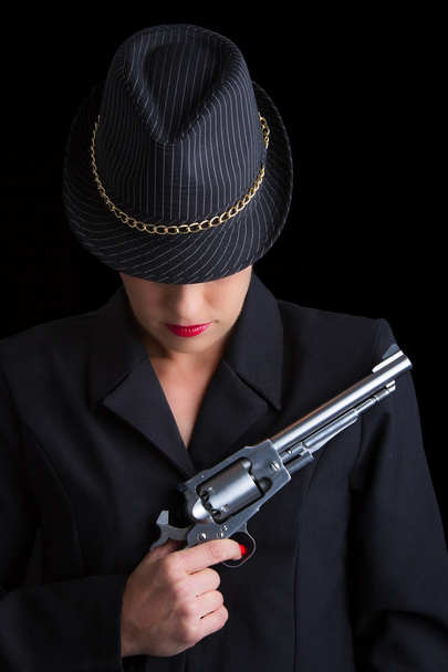 Dangerous woman in black with silver handgun - Фото, зображення