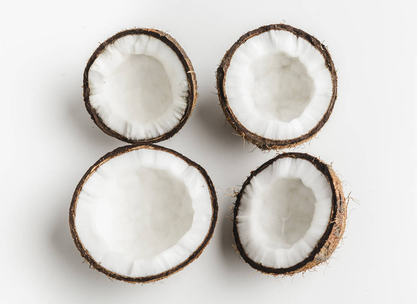 Ripe coconut pieces on white background, copy space - Фото, изображение