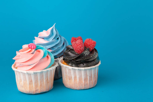 Birthday cupcakes on blue background close up - Φωτογραφία, εικόνα