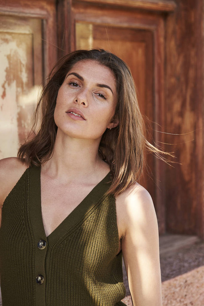 Beautiful brunette in green vest top, portrait - Fotografie, Obrázek