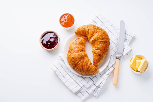 fresh croissants served with jams on white background. Morning meal concept - Fotografie, Obrázek