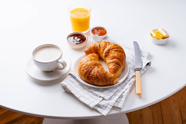 fresh croissants served with jams on white background. Morning meal concept - Zdjęcie, obraz