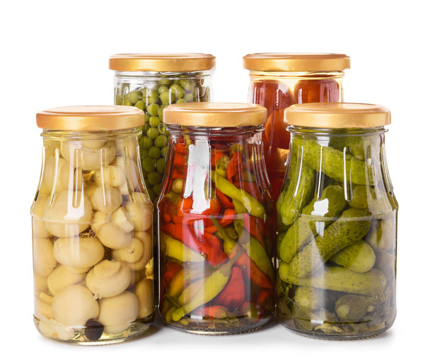 Jars with different canned vegetables, peas and mushrooms on white background - Photo, Image