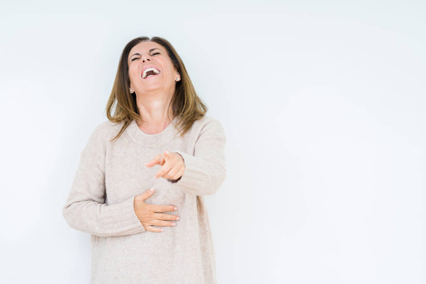 Beautiful middle age woman over isolated background Laughing of you, pointing to the camera with finger hand over chest, shame expression - Photo, Image