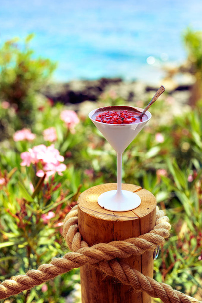 Strawberry desert with chocolate cream in glass. - Photo, Image