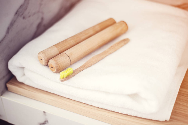 Bamboo toothbrushes on a shelf in the bathroom. Zero waste, eco, save planet - Fotografie, Obrázek
