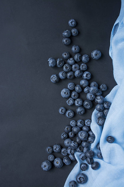 Fresh blueberries on a dark background. Space for text. - Photo, Image