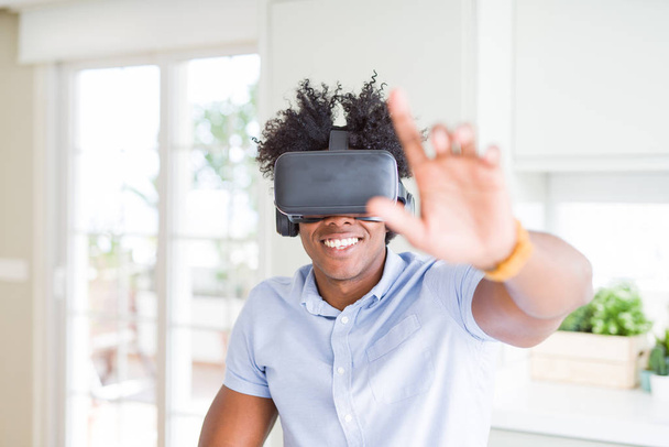 African amaerican man having fun playing with virtual reality gl - Photo, Image