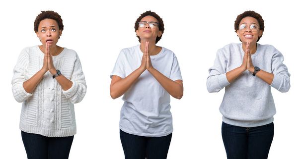 Jonge african american vrouw met afro haar over geïsoleerde achtergrond bedelen en bidden met handen samen met hoop uitdrukking op gezicht heel emotioneel en bang. Vragen om vergeving. Religie concept. - Foto, afbeelding