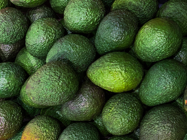 abacate close-up no mercado de fundo alimentar
 - Foto, Imagem