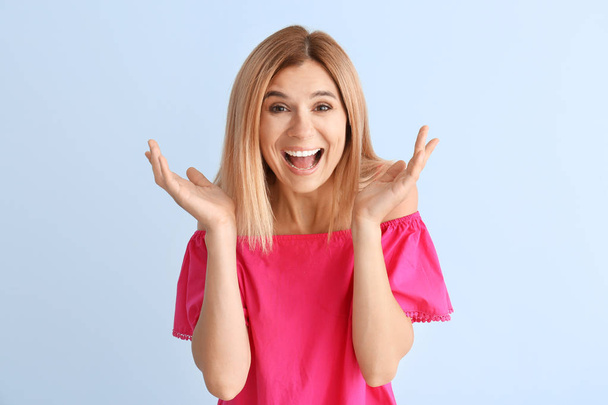 Happy beautiful woman on color background - Photo, image