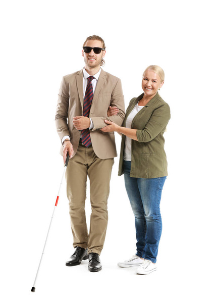 Blind young man with mother on white background - Photo, Image