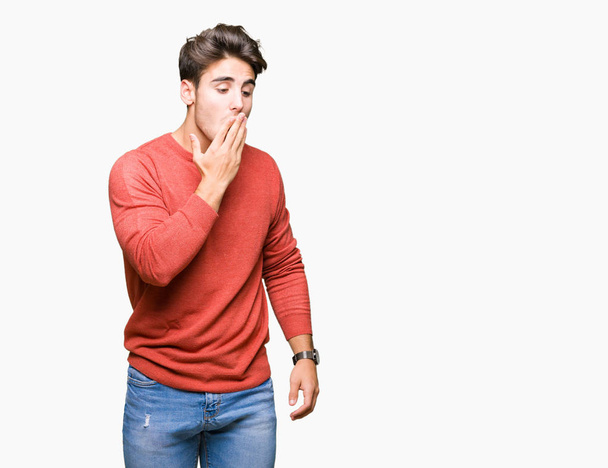 Young handsome man over isolated background bored yawning tired covering mouth with hand. Restless and sleepiness. - Photo, Image
