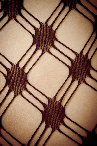Close up of Caucasian woman in pattern stockings - Фото, зображення