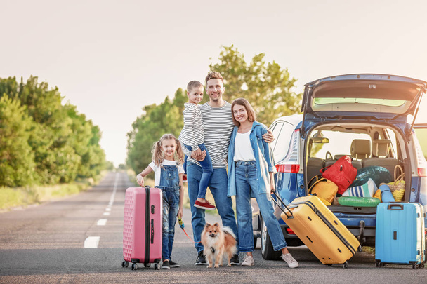 Happy family with luggage near car outdoors - Fotoğraf, Görsel