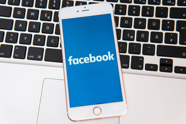 White iPhone with logo of social media Facebook on the screen - Φωτογραφία, εικόνα