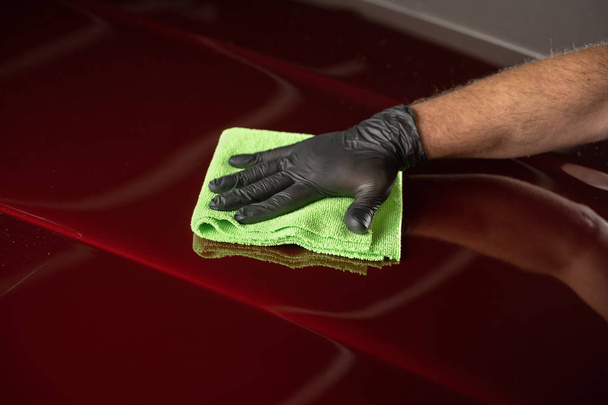 Man cleaning car with microfiber cloth,vintage old car detailing - Фото, зображення