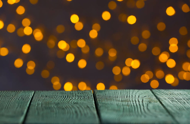 Wooden table and colorful defocused lights - Foto, immagini