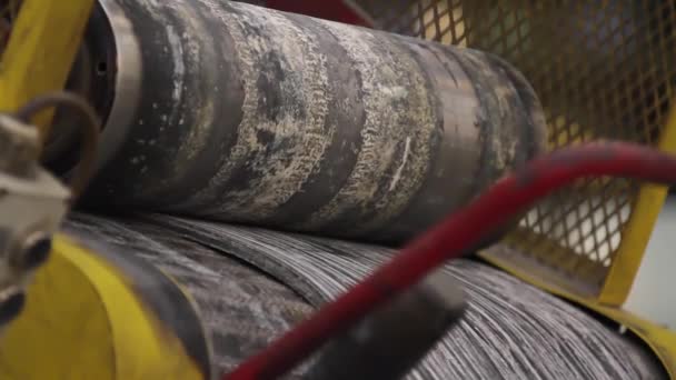 Tire production. Rubber tape on a rolling machine. - Footage, Video