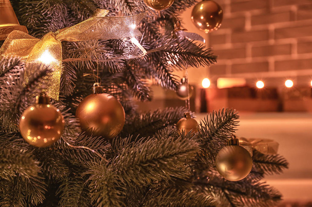 Beautifully decorated Christmas tree in room, closeup - Fotografie, Obrázek