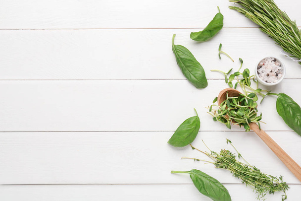 Different fresh herbs and spices on white wooden background - Foto, Imagen