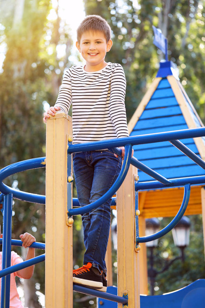 Cute little boy on playground - Foto, imagen