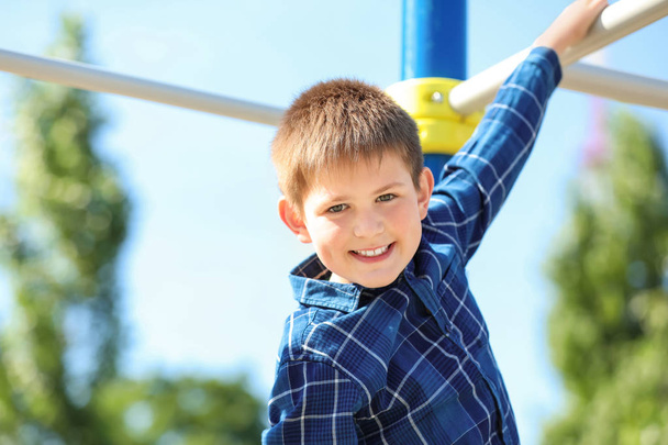 Cute little boy on playground - Fotoğraf, Görsel