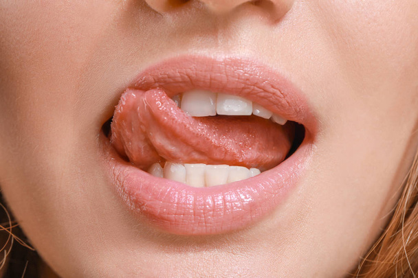Young woman with beautiful lips, closeup - Photo, Image