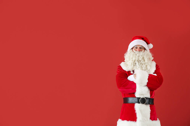 Portrait of Santa Claus on color background - Foto, Imagen