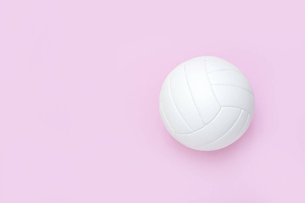 White volleyball leather ball on pink background. Top view. - Foto, Imagem