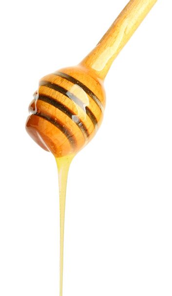 Дерев'яний медовий диппер на білому тлі
 - Фото, зображення