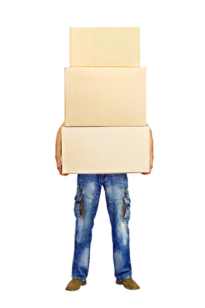 Чоловік тримає стопку картонних коробок
 - Фото, зображення