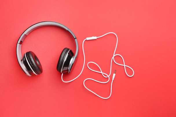 Modern headphones on color background - Photo, Image