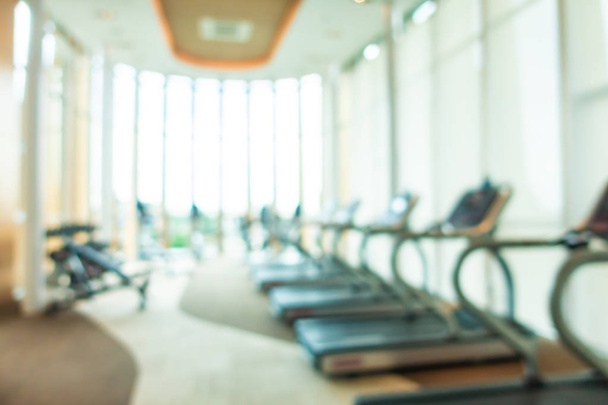 Abstract blur and defocus fitness equipment in gym room interior - Foto, imagen