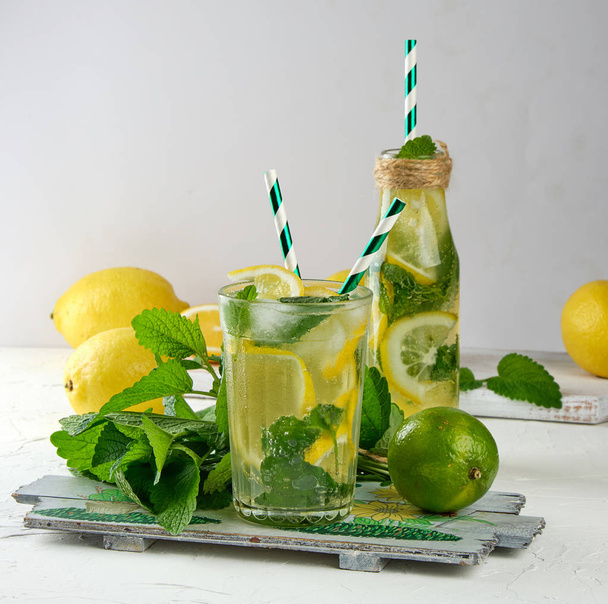 summer refreshing drink lemonade with lemons, mint leaves, lime  - Photo, Image