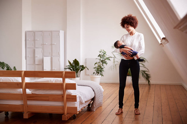 Loving Mother Holding Newborn Baby At Home In Loft Apartment - Zdjęcie, obraz