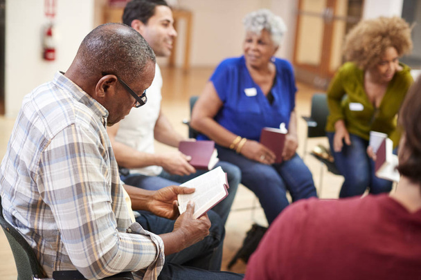 People Attending Bible Study Or Book Group Meeting In Community Center - Photo, Image