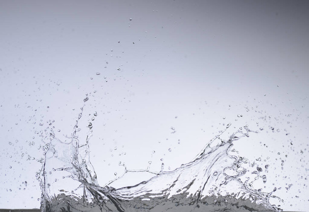 Moving water on white background - Photo, Image
