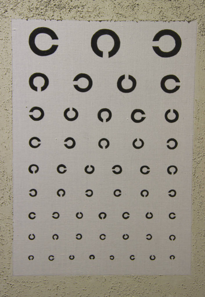 table to check visual acuity hanging on the wall - Photo, Image
