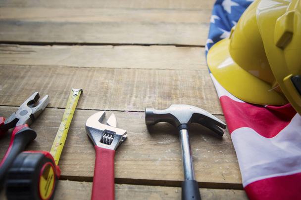 Construction tools on the table with American flag - 写真・画像