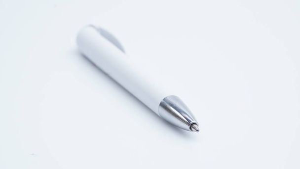 White and silver color ballpoint pen isolated on white background. - Foto, Imagem