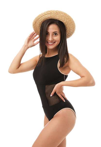 Pretty sexy woman with slim body in stylish black bikini on white background - Photo, Image