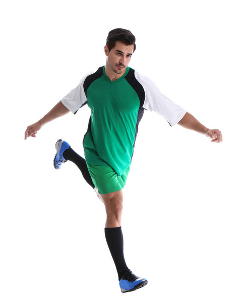 Young man playing football on white background - Photo, image