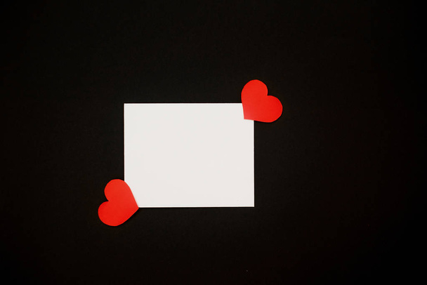 Red hearts on black background. for banner background, copy space, background for love card - Fotó, kép